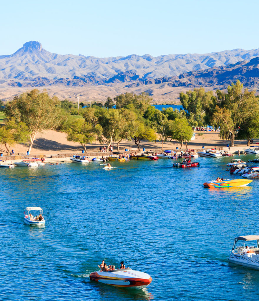 River rat life on Lake Havasu with boats under London Bridge.